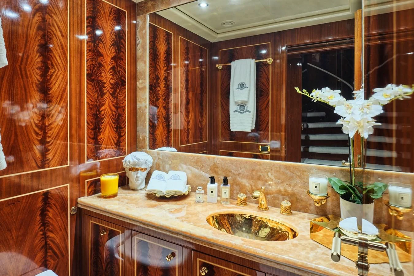a bathroom with a flower vase and sink aboard ABILITY Yacht for Sale