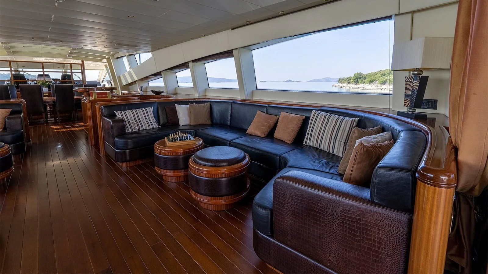 a living room with a leather couch aboard ABILITY Yacht for Sale