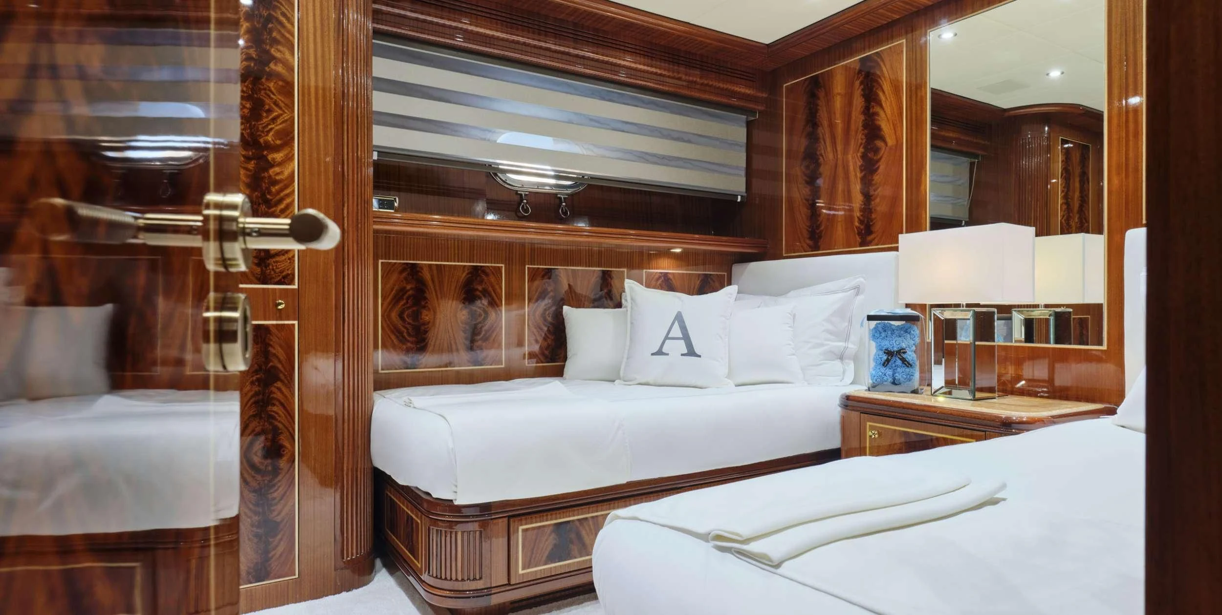 a room with two beds aboard ABILITY Yacht for Sale