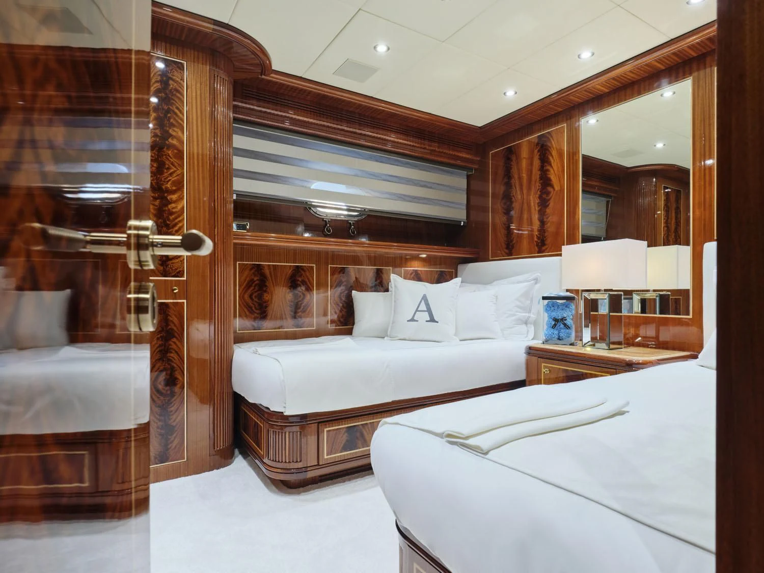 a room with a bed and a mirror aboard ABILITY Yacht for Sale