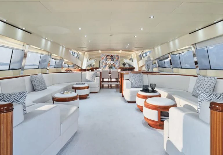 a room with white couches and a television aboard ABILITY Yacht for Sale