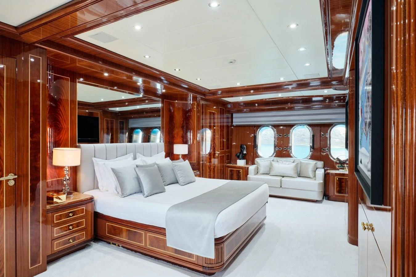 a large bedroom with a large bed aboard ABILITY Yacht for Sale