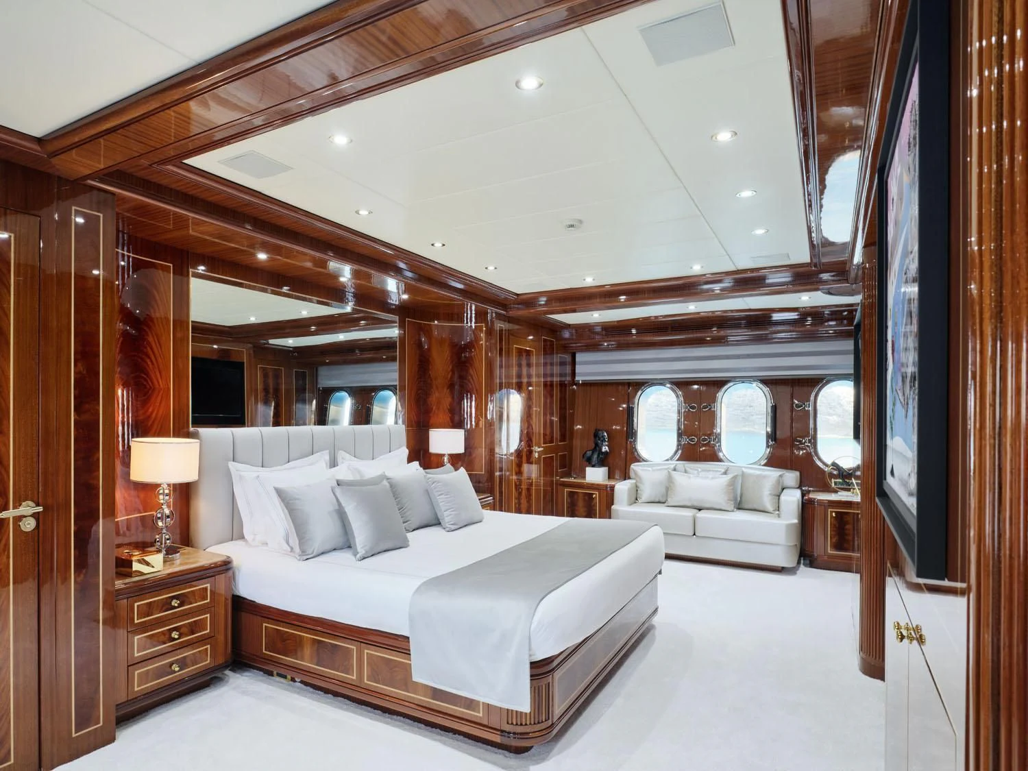 a large bedroom with a large bed aboard ABILITY Yacht for Sale