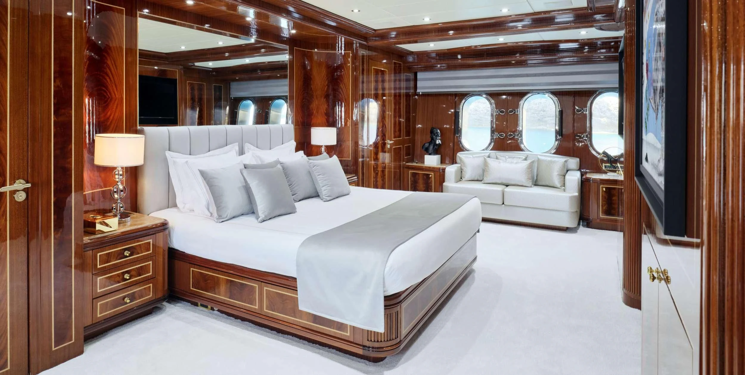 a room with a bed and a television aboard ABILITY Yacht for Sale