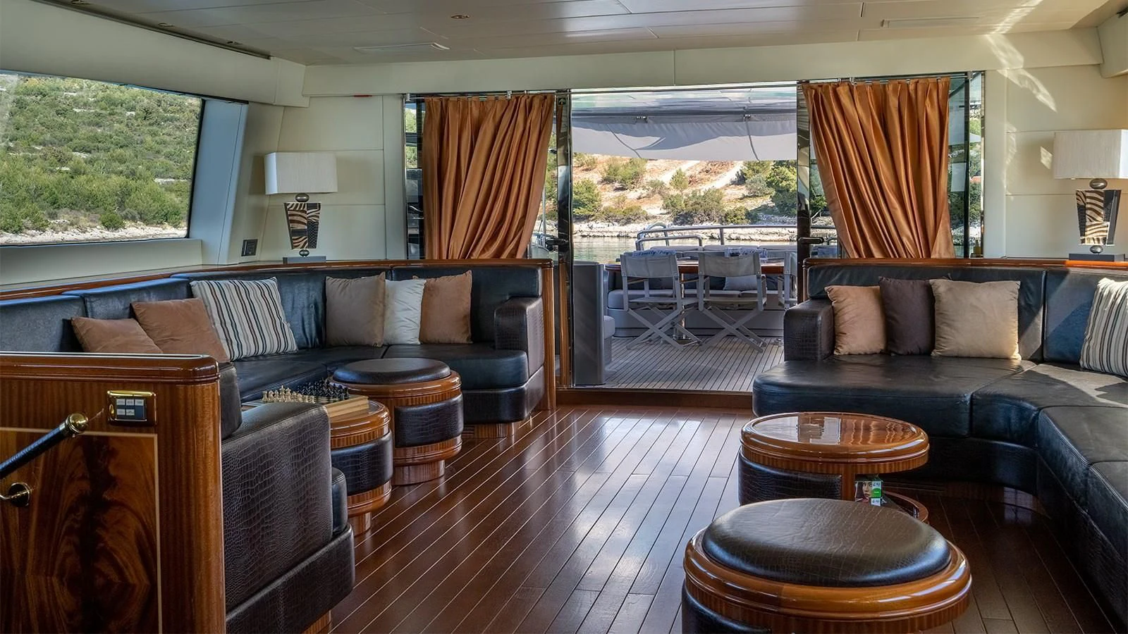a living room with a wood floor aboard ABILITY Yacht for Sale