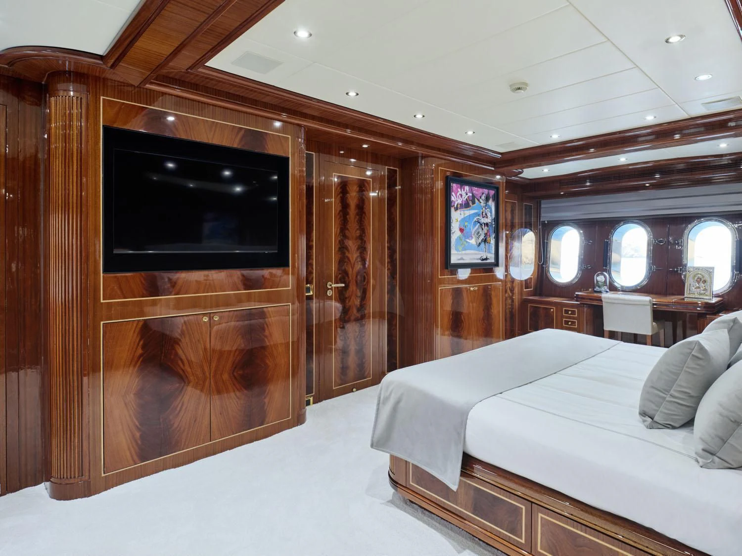 a room with a bed and a television aboard ABILITY Yacht for Sale