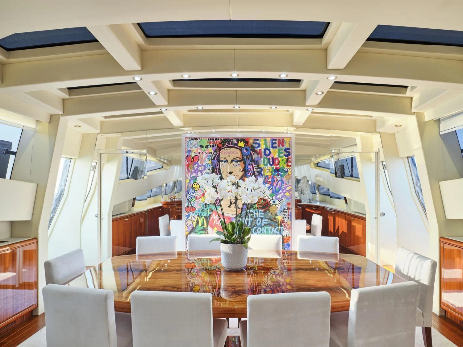 a room with tables and chairs aboard ABILITY Yacht for Sale