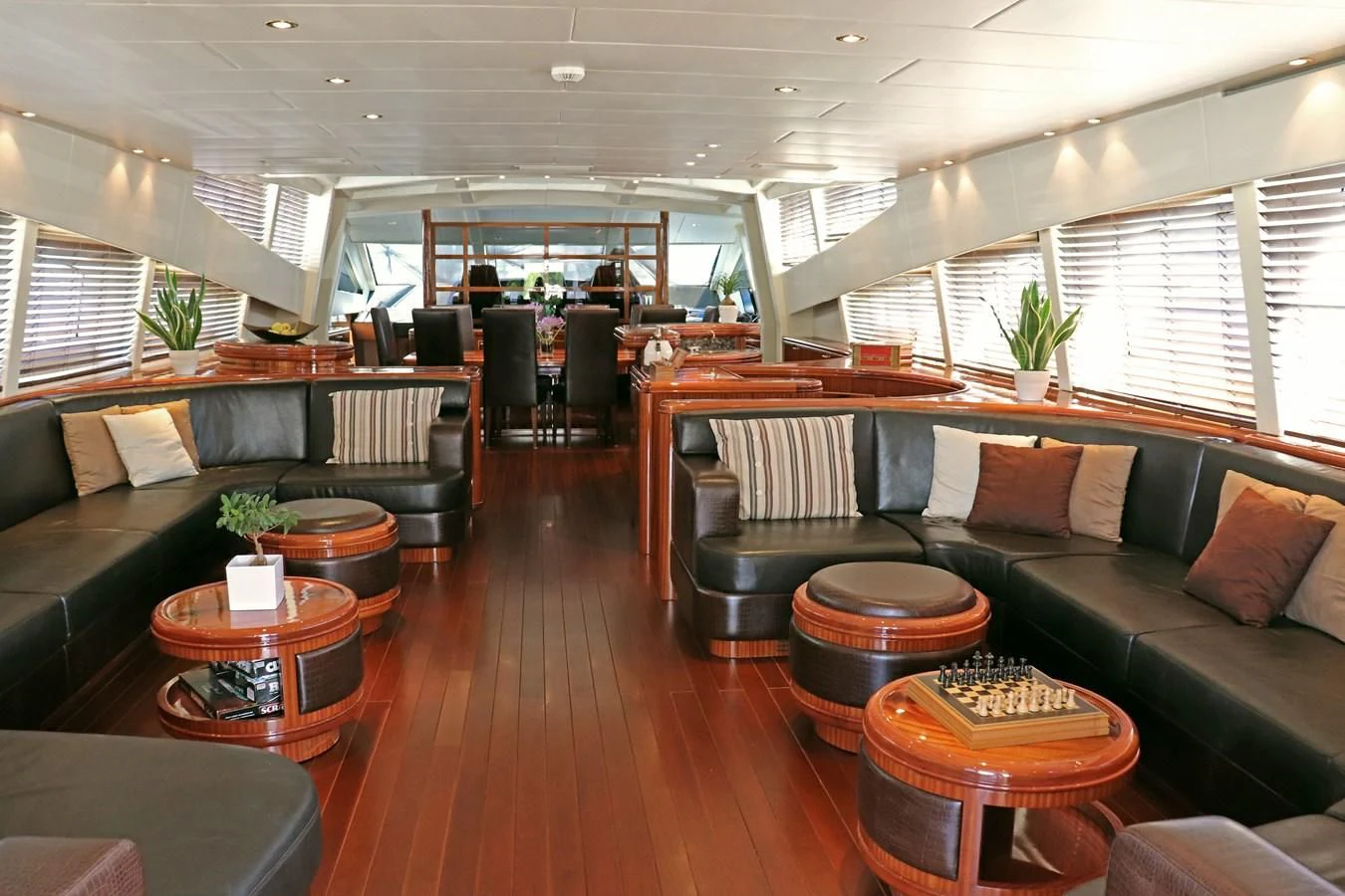 a living room with a wood floor aboard ABILITY Yacht for Sale