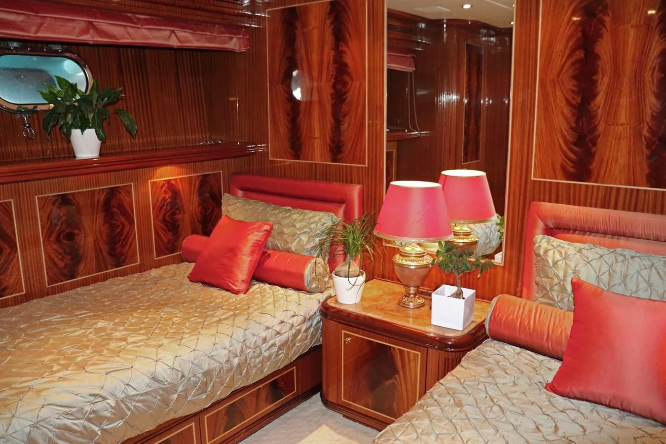 a room with a bed and a table aboard ABILITY Yacht for Sale