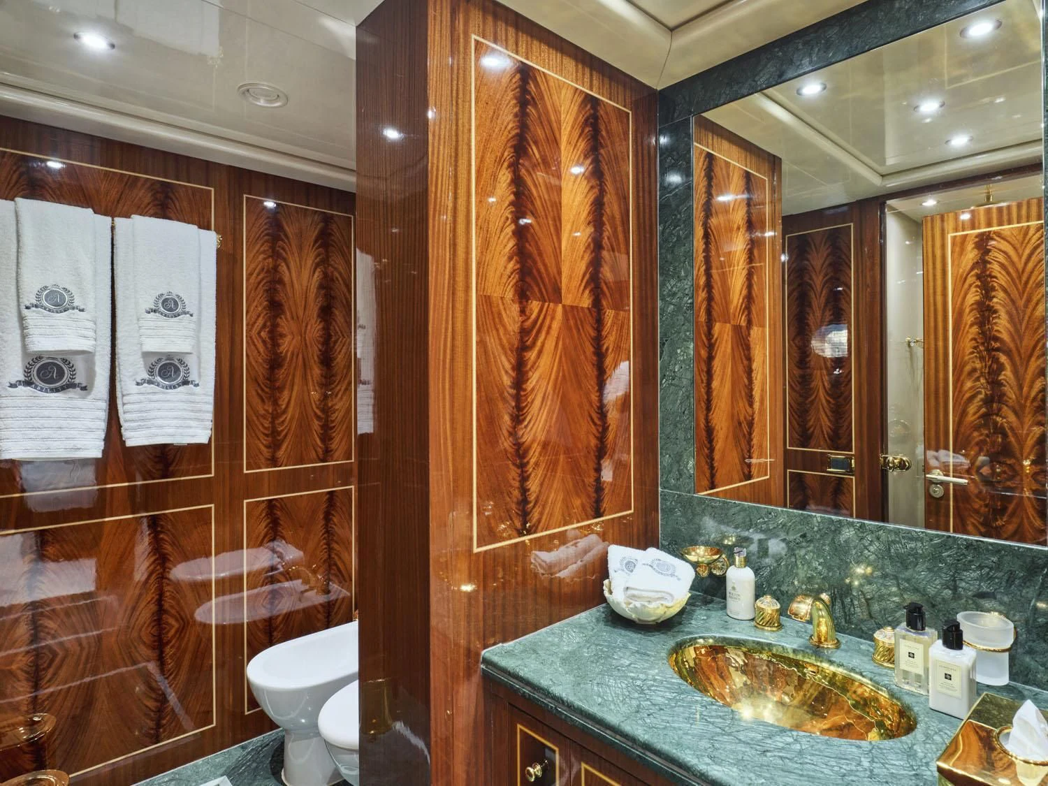 a bathroom with a large mirror aboard ABILITY Yacht for Sale