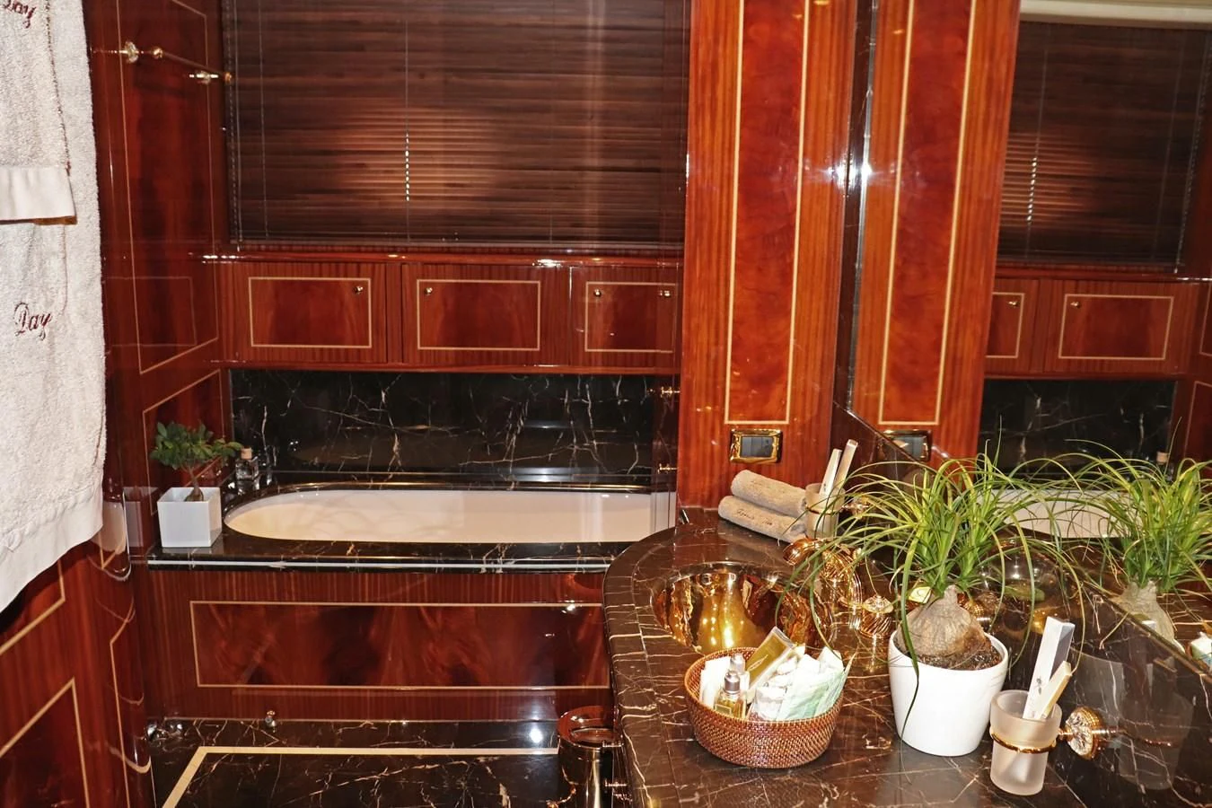a kitchen with wooden cabinets aboard ABILITY Yacht for Sale