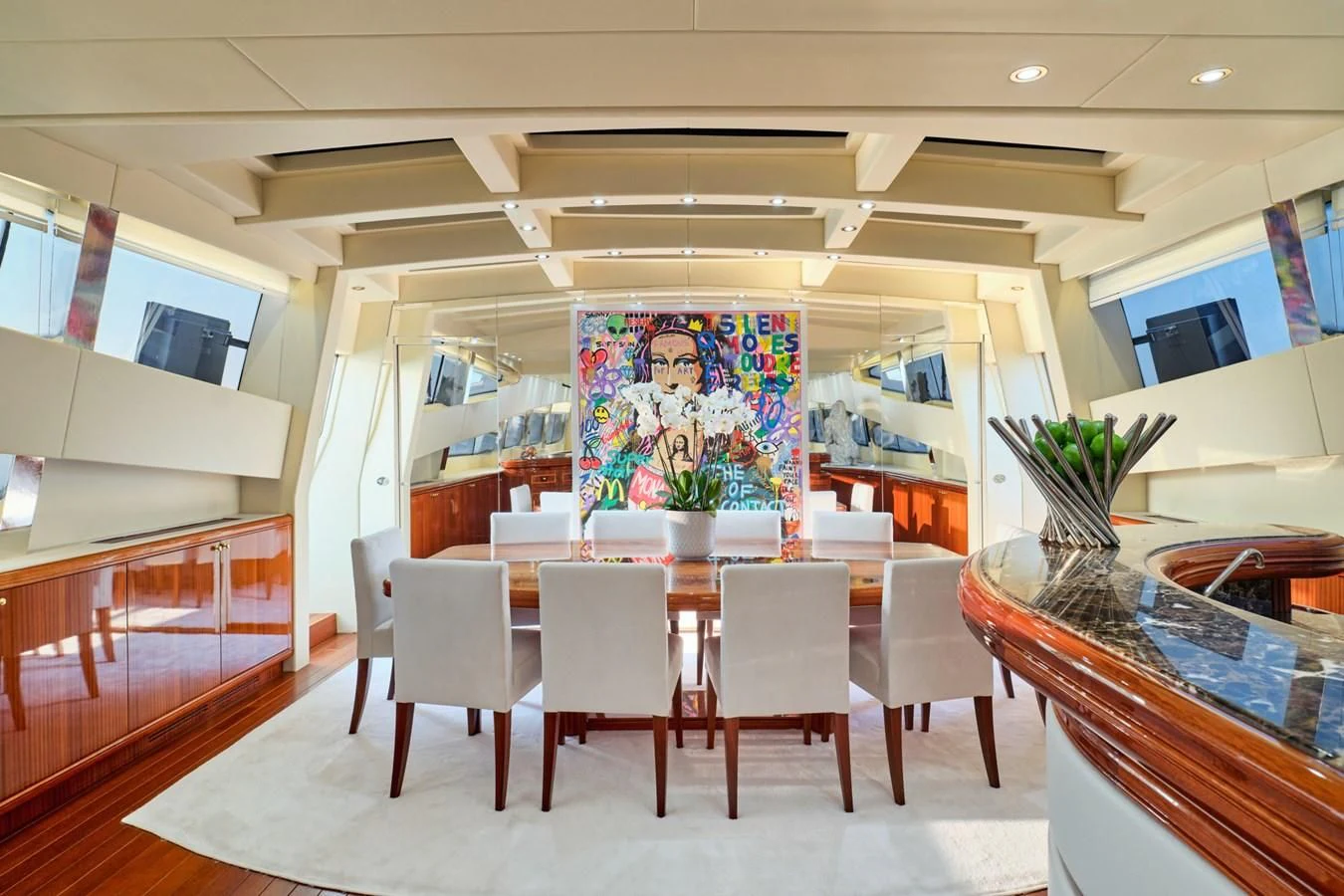 a room with tables and chairs aboard ABILITY Yacht for Sale