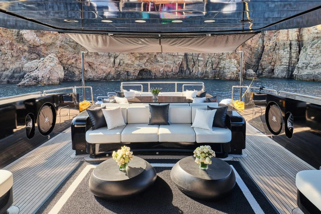 a large white couch on a patio aboard ABILITY Yacht for Sale