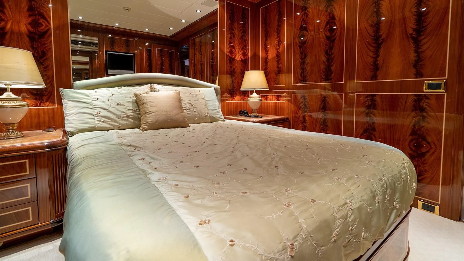 a bed with white sheets aboard ABILITY Yacht for Sale