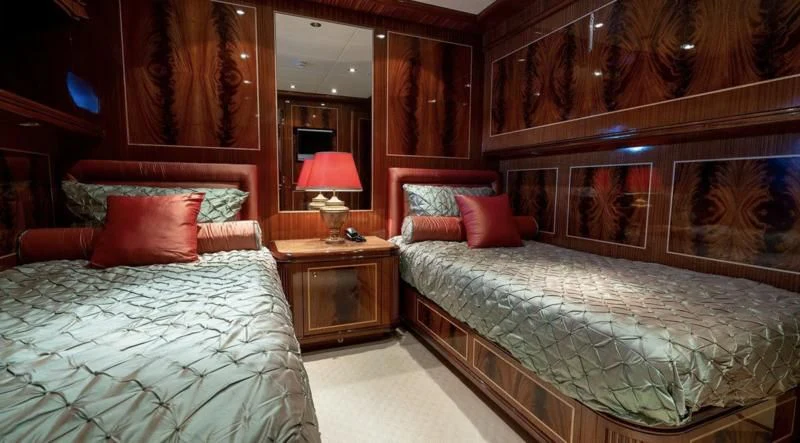 a room with two beds aboard ABILITY Yacht for Sale