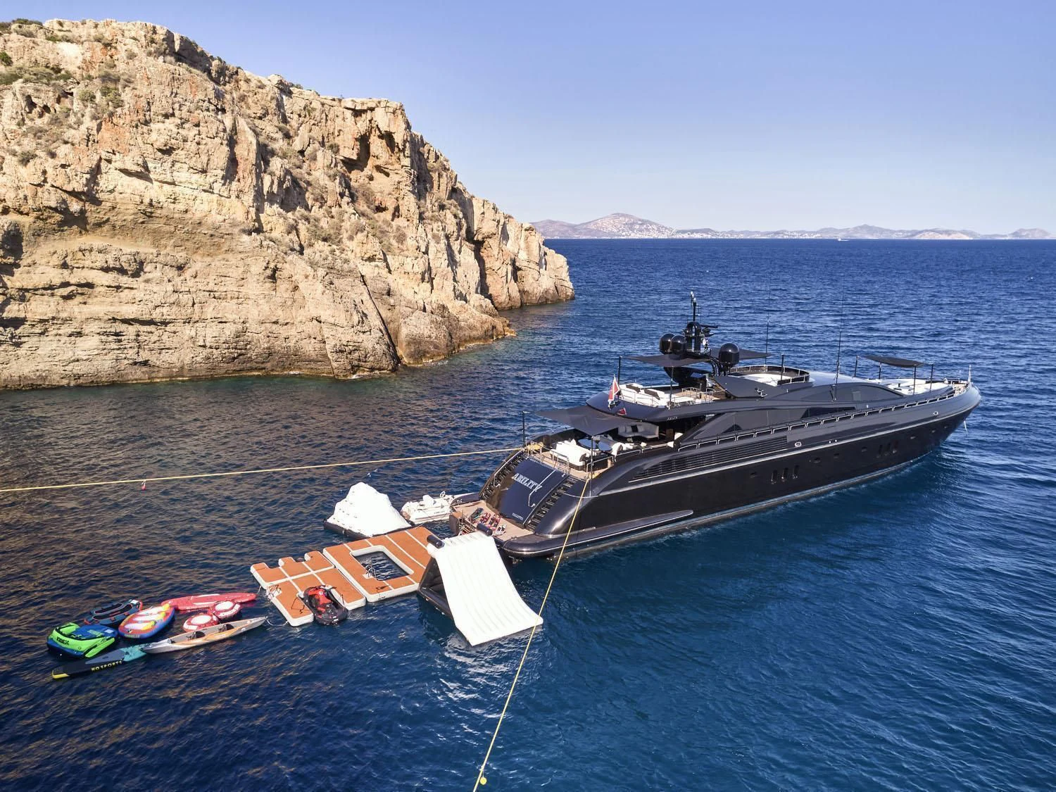 a boat tied to a dock aboard ABILITY Yacht for Sale