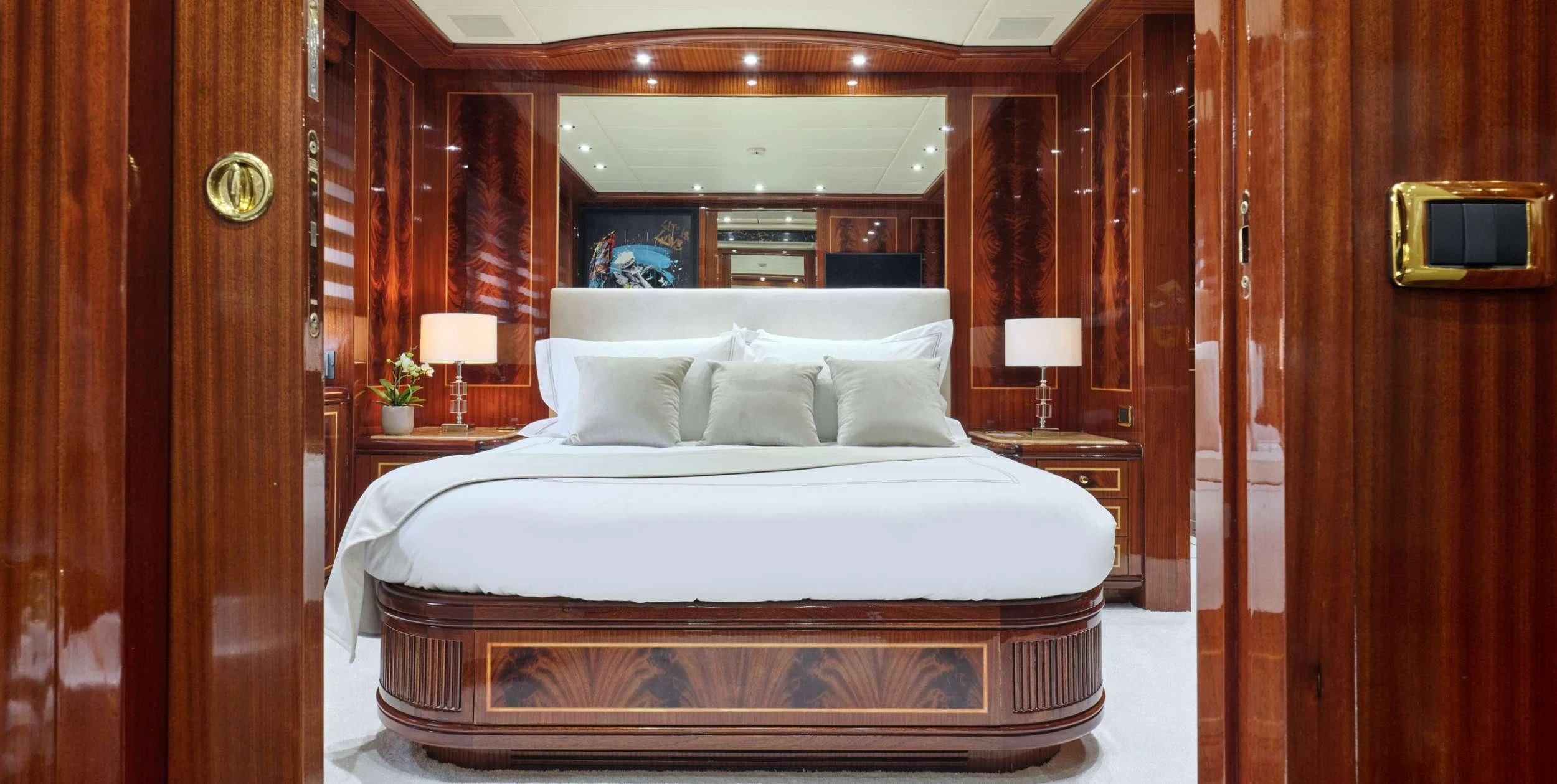 a bed with white sheets aboard ABILITY Yacht for Sale