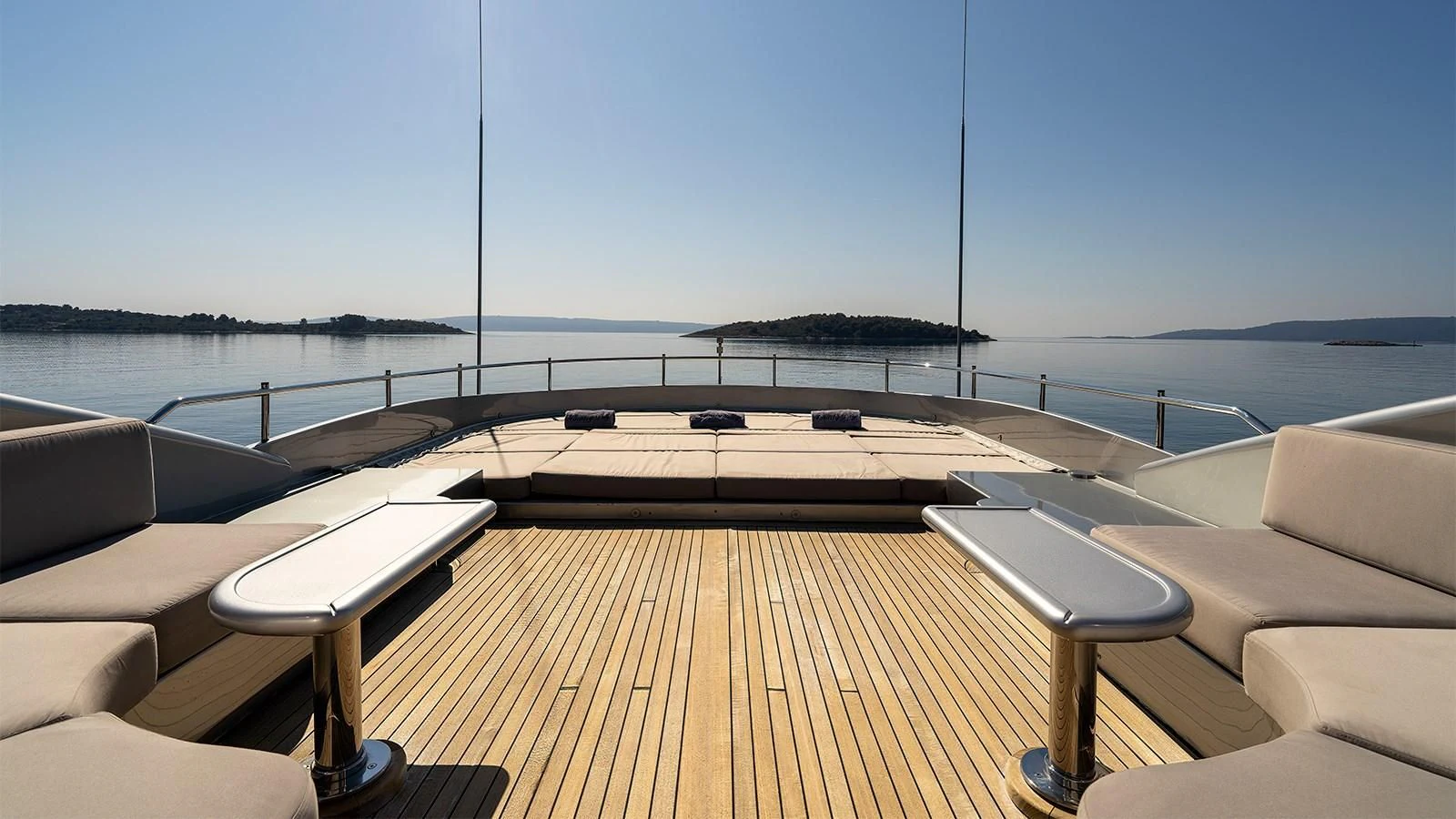 a deck with a pool and chairs on it aboard ABILITY Yacht for Sale