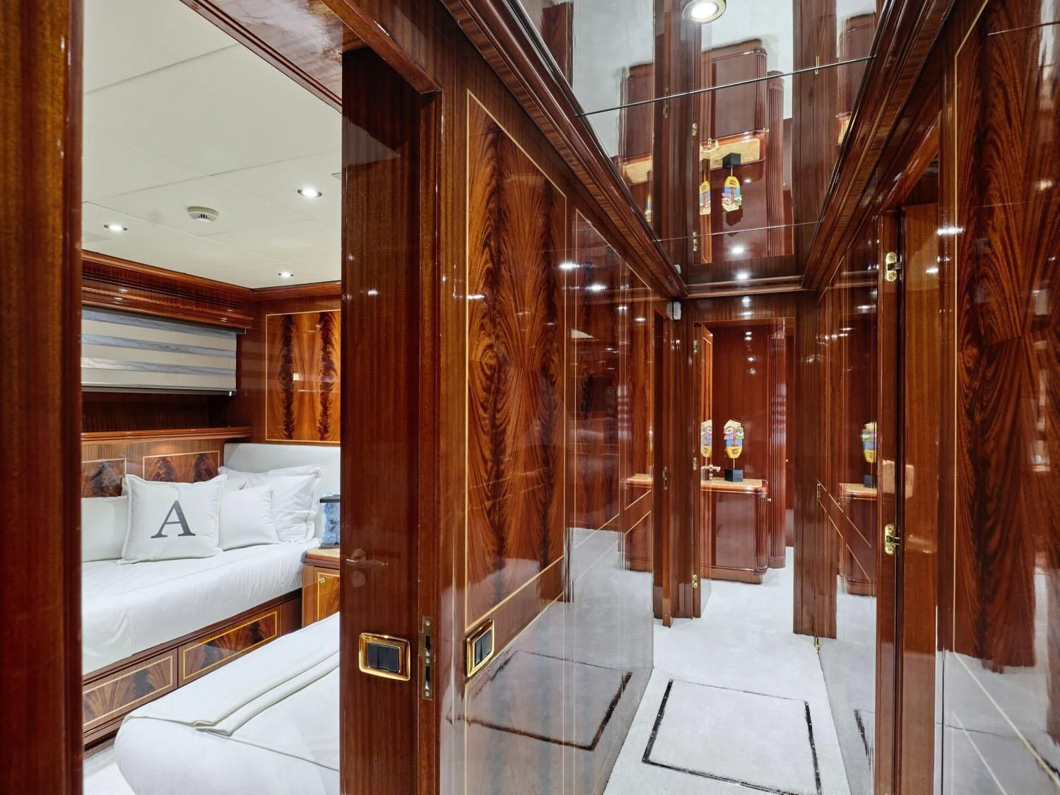a room with a bed and a mirror aboard ABILITY Yacht for Sale