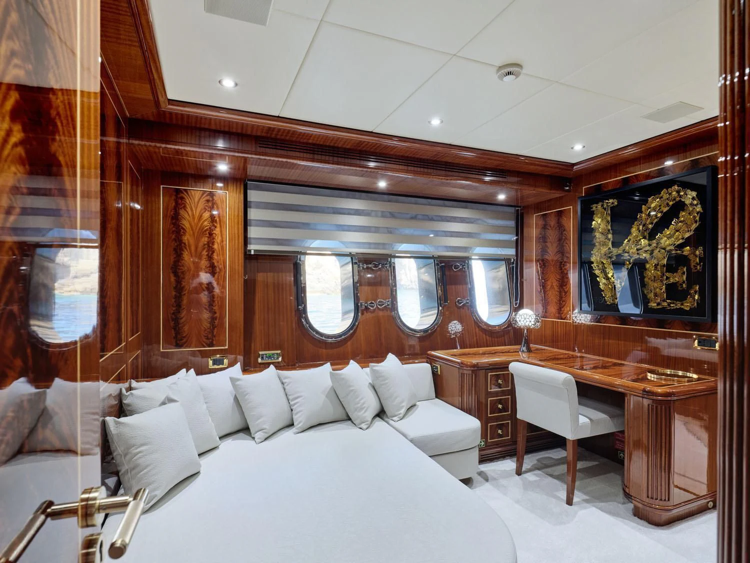a room with a bed and a desk aboard ABILITY Yacht for Sale