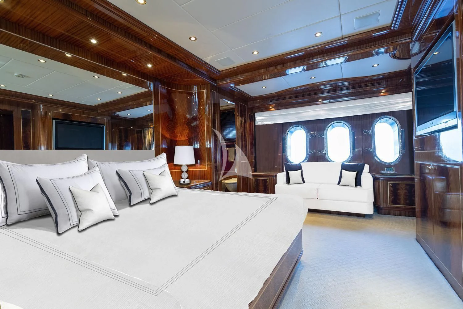 a room with a bed and a large mirror aboard ABILITY Yacht for Sale
