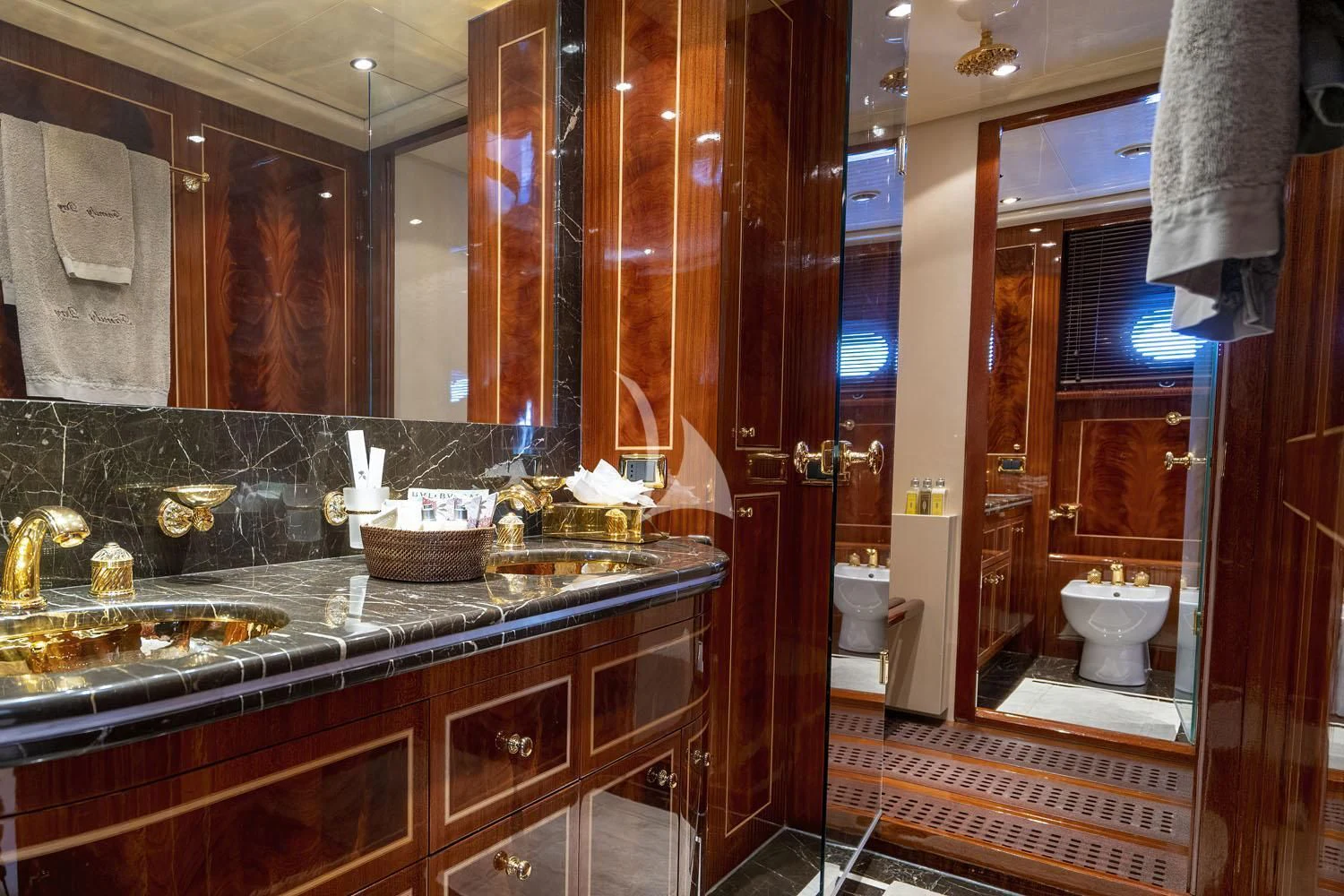 a bathroom with a large mirror aboard ABILITY Yacht for Sale