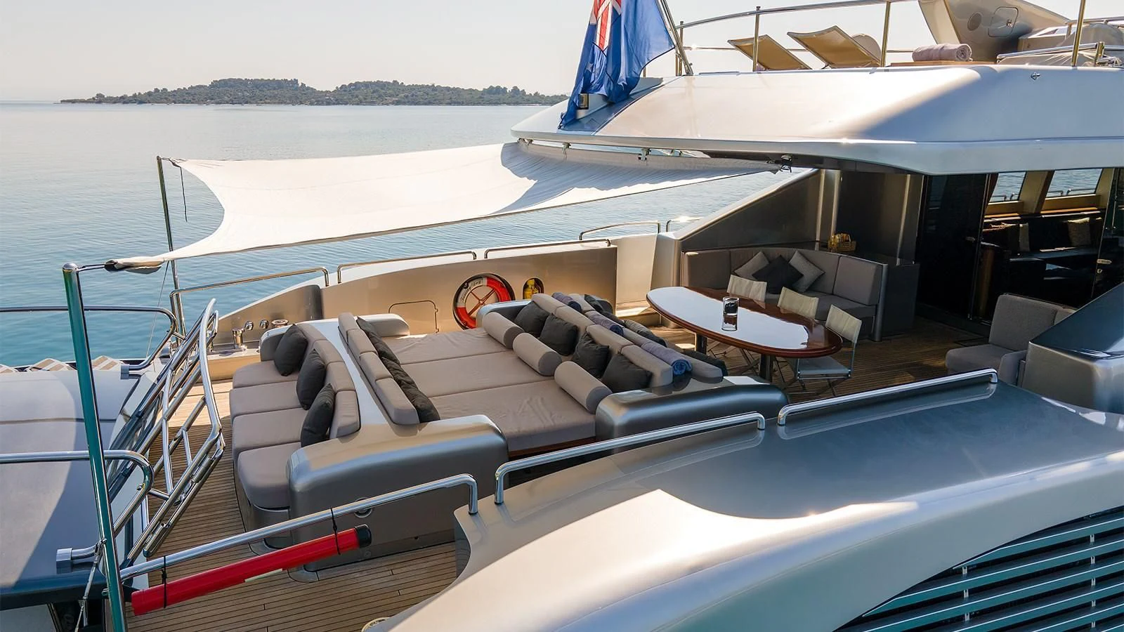 a boat with a deck and chairs aboard ABILITY Yacht for Sale