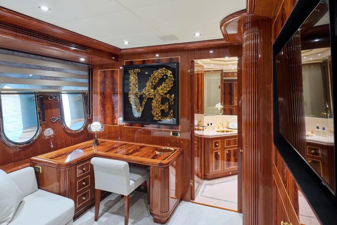 a room with a desk and chairs aboard ABILITY Yacht for Sale