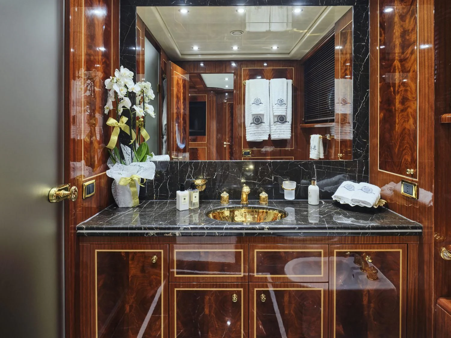 a bathroom with a sink and cabinets aboard ABILITY Yacht for Sale