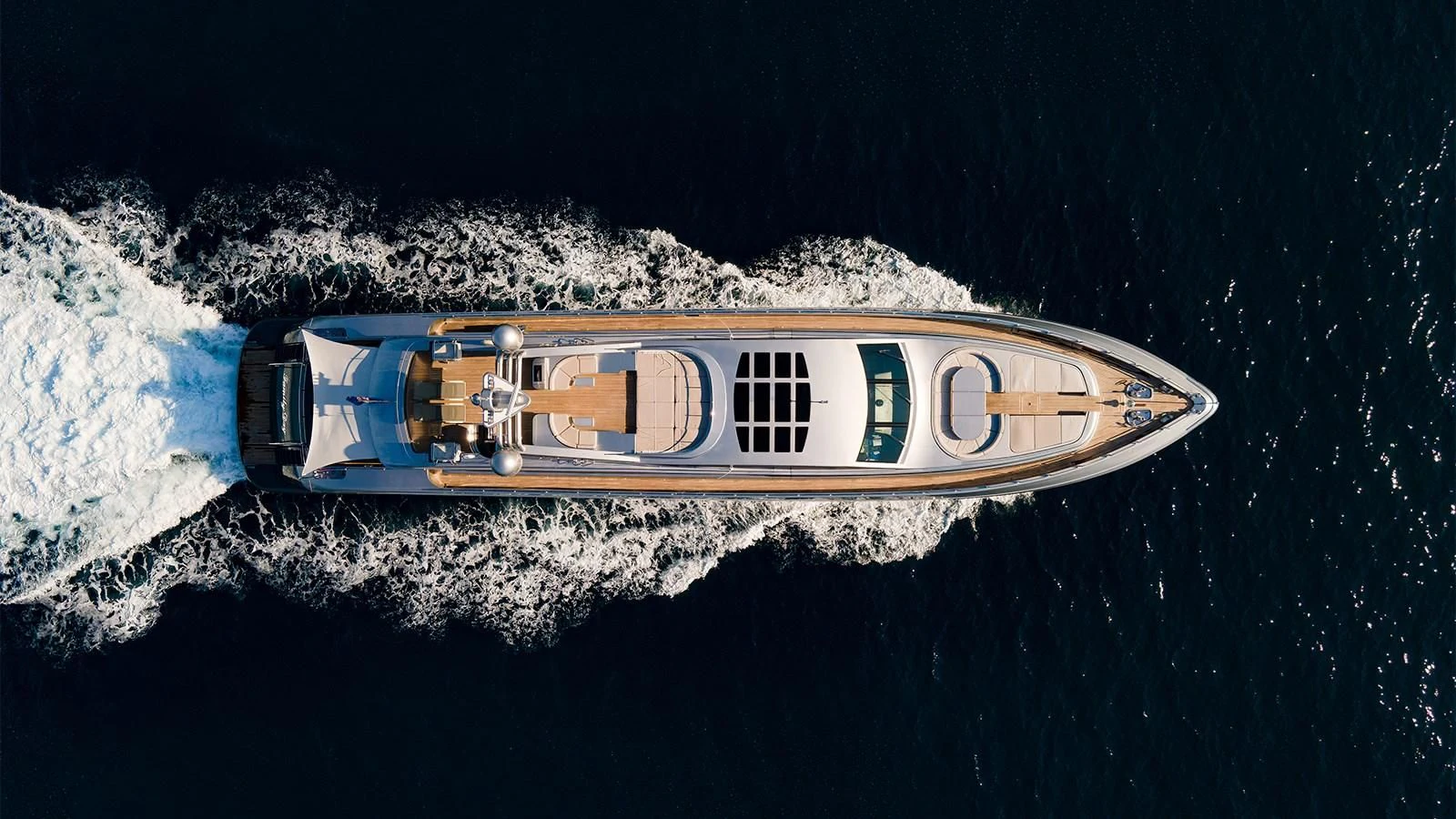 a gold and blue object with a white center on a black surface aboard ABILITY Yacht for Sale