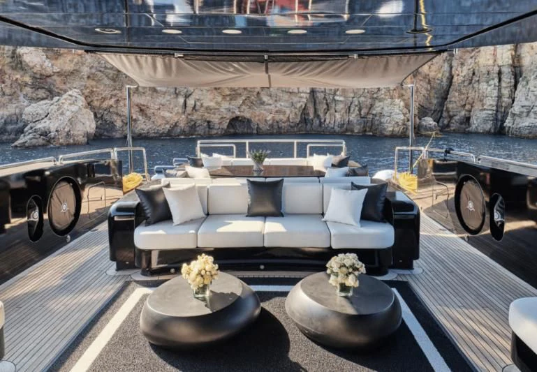 a large white couch with a table in front of it aboard ABILITY Yacht for Sale