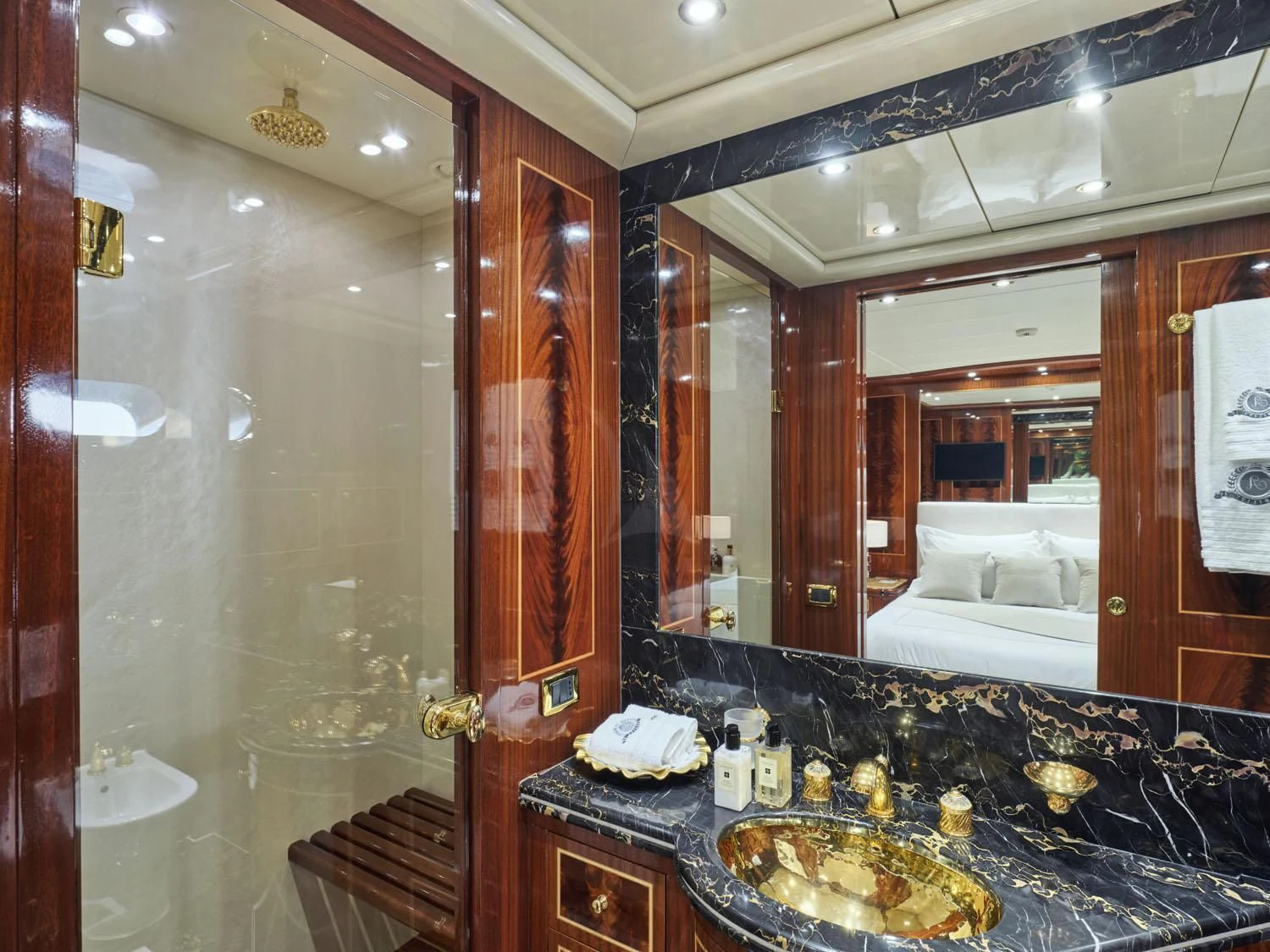 a bathroom with a large mirror aboard ABILITY Yacht for Sale
