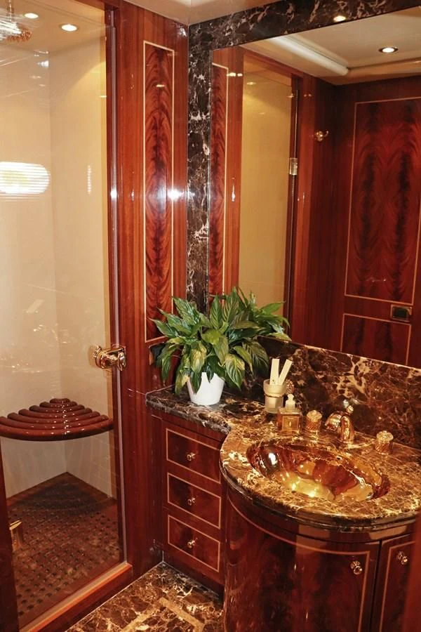 a bathroom with a sink and a mirror aboard ABILITY Yacht for Sale