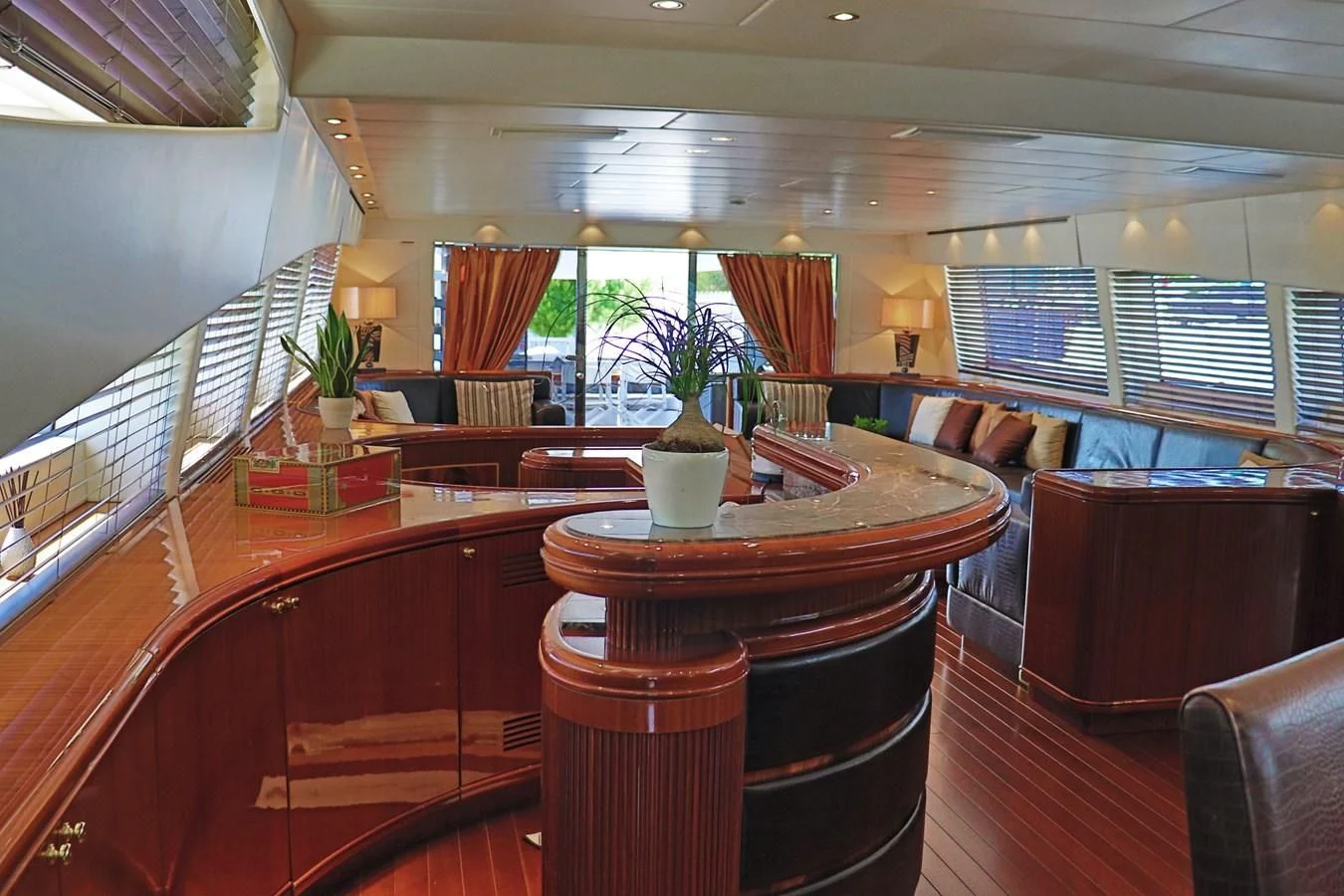a large room with a table and chairs aboard ABILITY Yacht for Sale