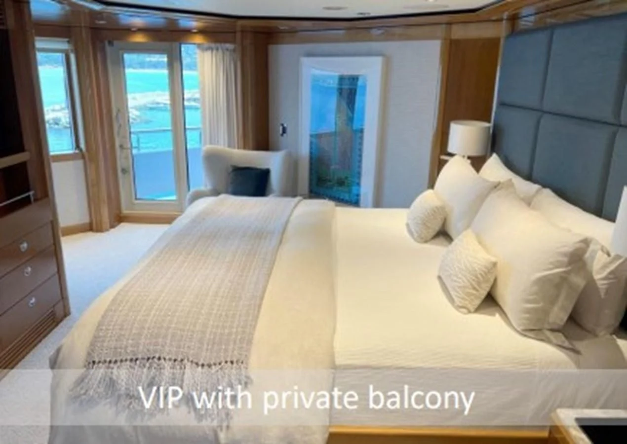 a bed with white sheets aboard SEANASH Yacht for Sale