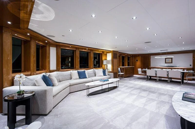 a large living room with a white couch and a table aboard SEANASH Yacht for Sale