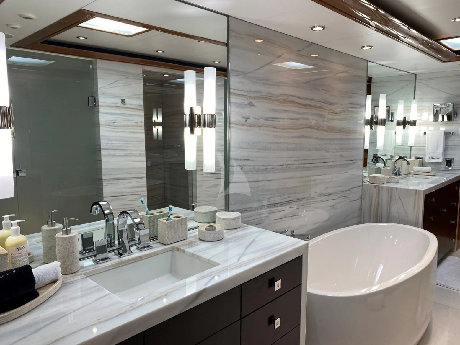 a bathroom with a large mirror aboard SEANASH Yacht for Sale