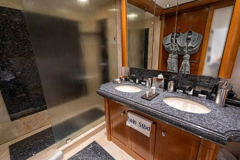 a bathroom with a large mirror aboard SEANASH Yacht for Sale