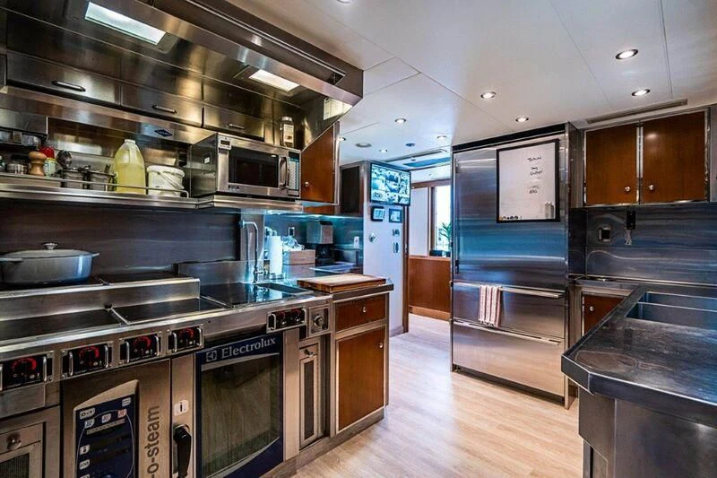 a kitchen with a large oven and a microwave aboard SEANASH Yacht for Sale