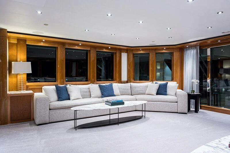 a living room with a couch and a coffee table aboard SEANASH Yacht for Sale
