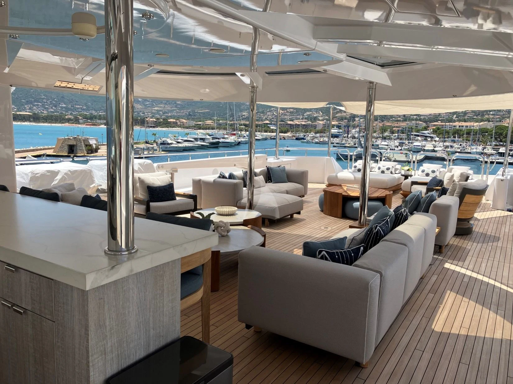 a room with a view of the ocean and a city aboard SEANASH Yacht for Sale