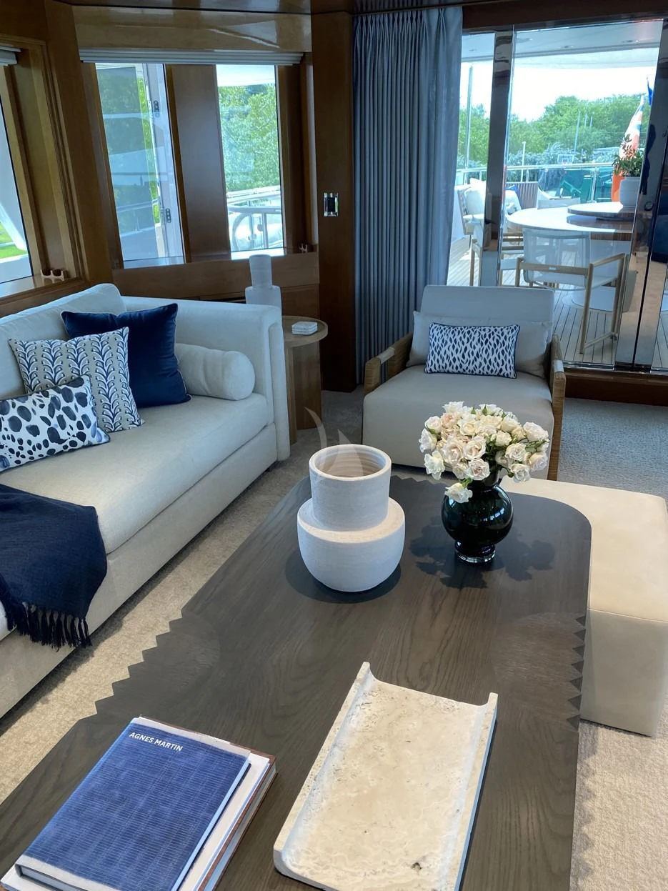 a living room with a couch and a coffee table aboard SEANASH Yacht for Sale