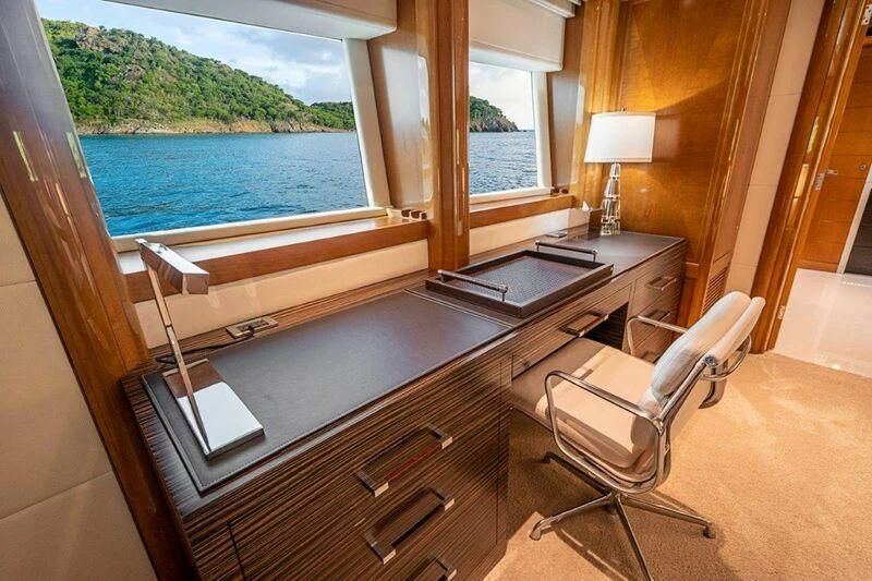 a room with a piano and a large window aboard SEANASH Yacht for Sale