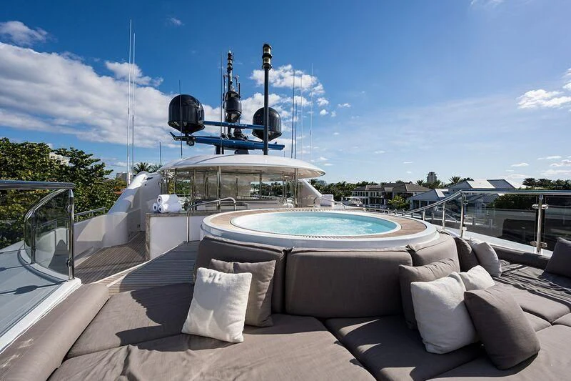 a large white pool with pillows and a large metal dome on a sunny day aboard SEANASH Yacht for Sale