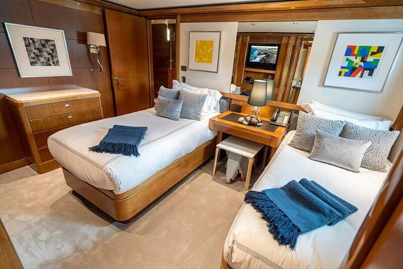 a room with a bed and a table aboard SEANASH Yacht for Sale