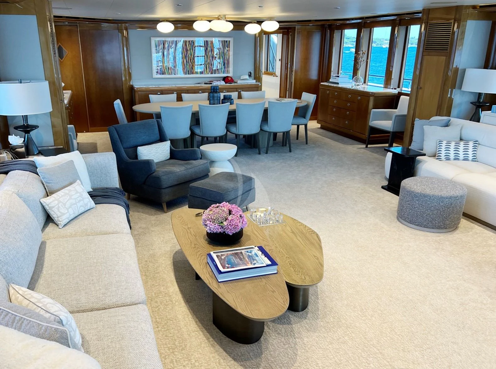a living room with a large table and chairs aboard SEANASH Yacht for Sale