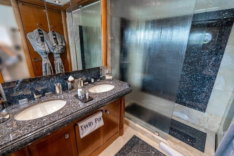 a bathroom with a large mirror aboard SEANASH Yacht for Sale