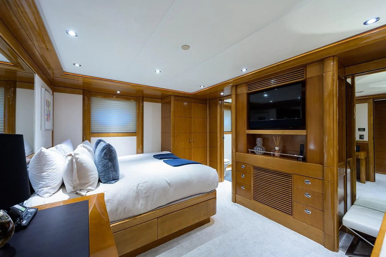 a bedroom with a bed and tv aboard SEANASH Yacht for Sale