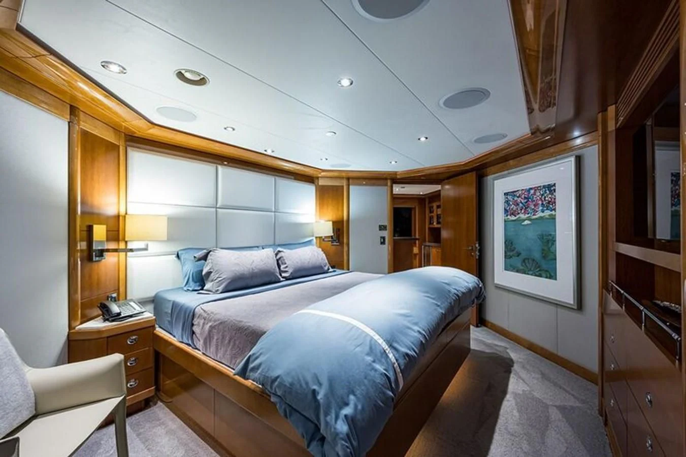 a bedroom with a large bed aboard SEANASH Yacht for Sale