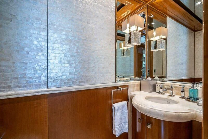 a bathroom with a large mirror aboard SEANASH Yacht for Sale